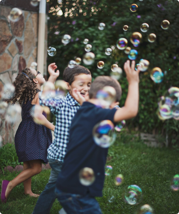 children playing with bubbles