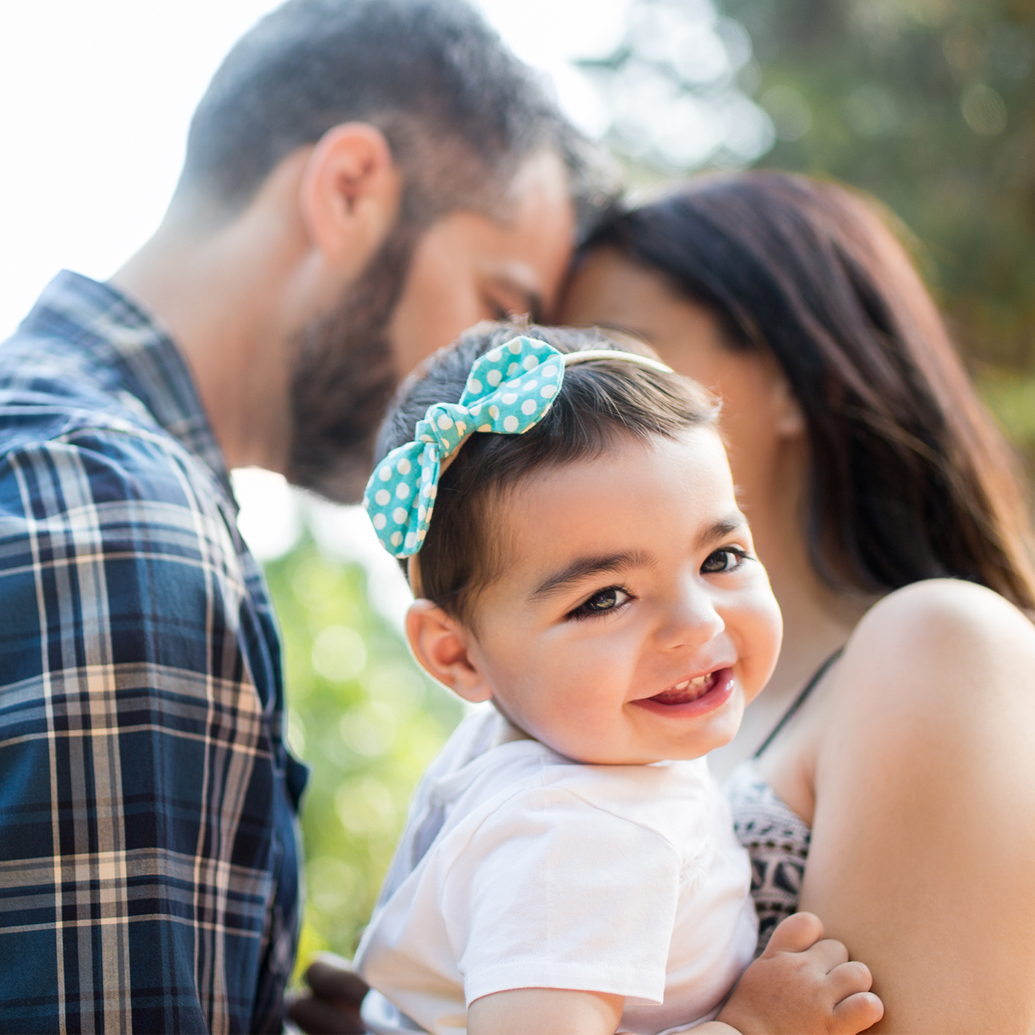 man and woman with young child