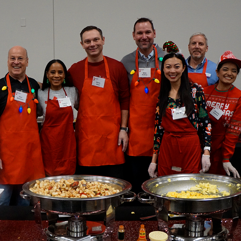 KCSL Red Stocking Breakfast Wichita celebrity servers: Commissioner Pete Meitzner, KWCH's Felicia Rolfe, Commissioner Ryan Baty, Mike Pelfrey, Mayor Lily Wu, KCSL CFO Kent Curran and KWCH's Annette Lawless