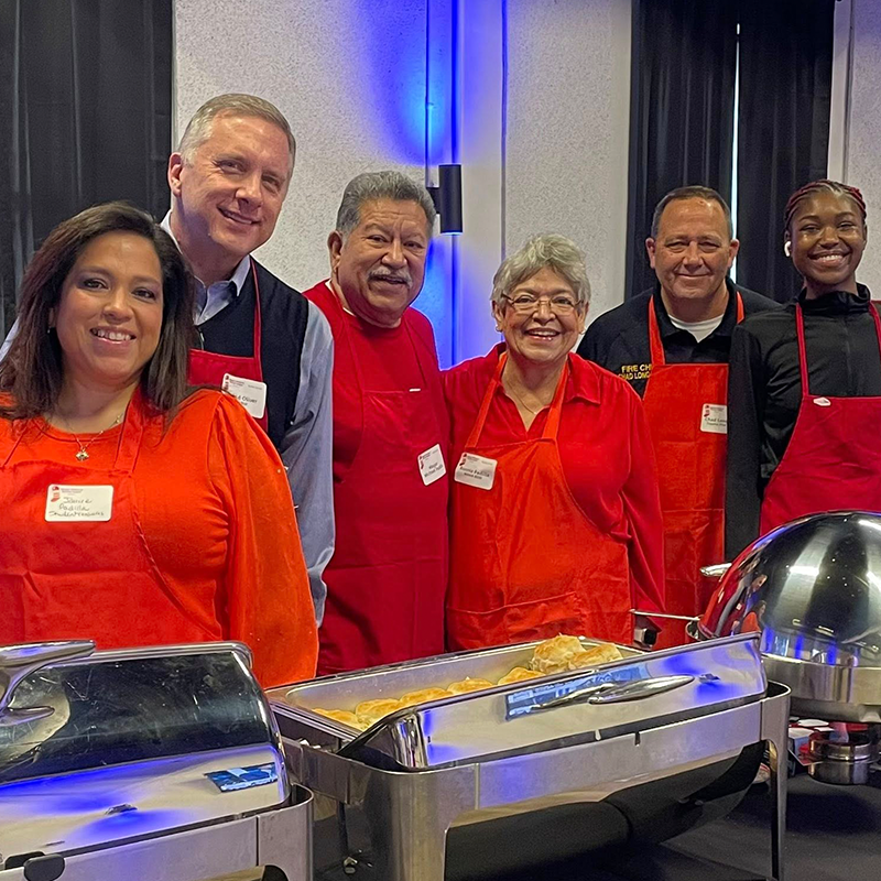 KCSL Red Stocking Breakfast Topeka volunteers serve buffet